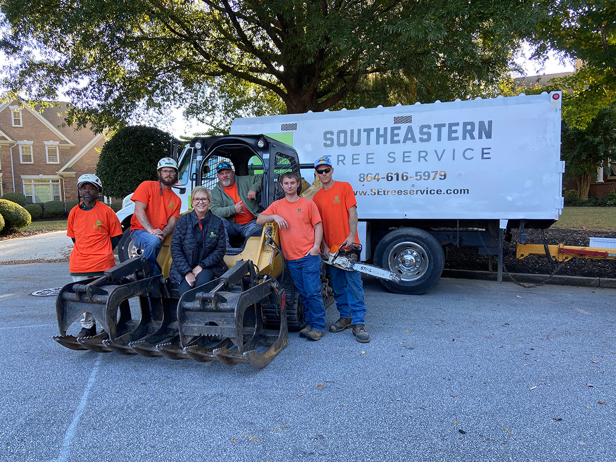 Southeastern Tree Service team photo standing in front of company truck.